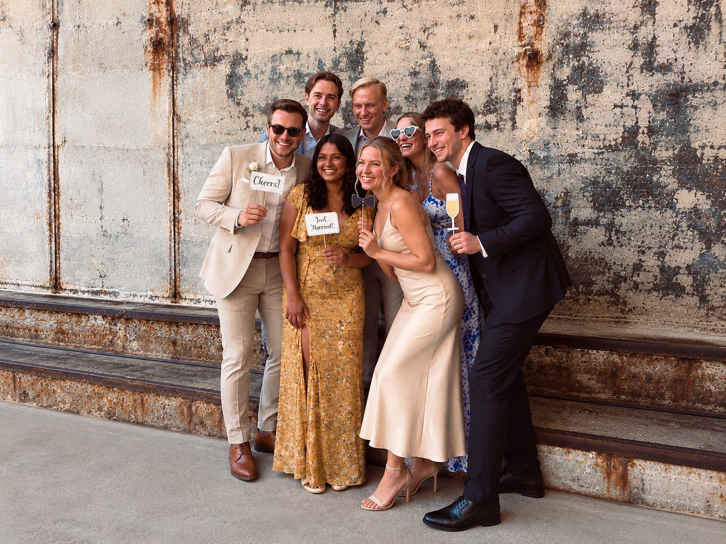 Guests with a crown and props laughing and dancing in front of SelfieCircle